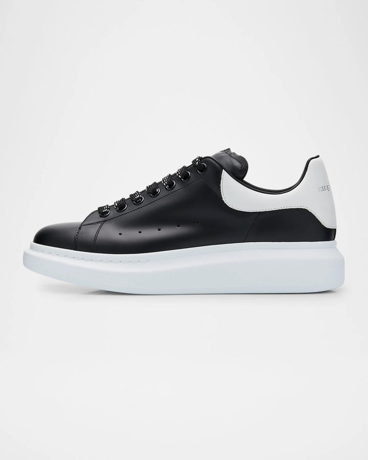 Black and white sneaker on a light gray background